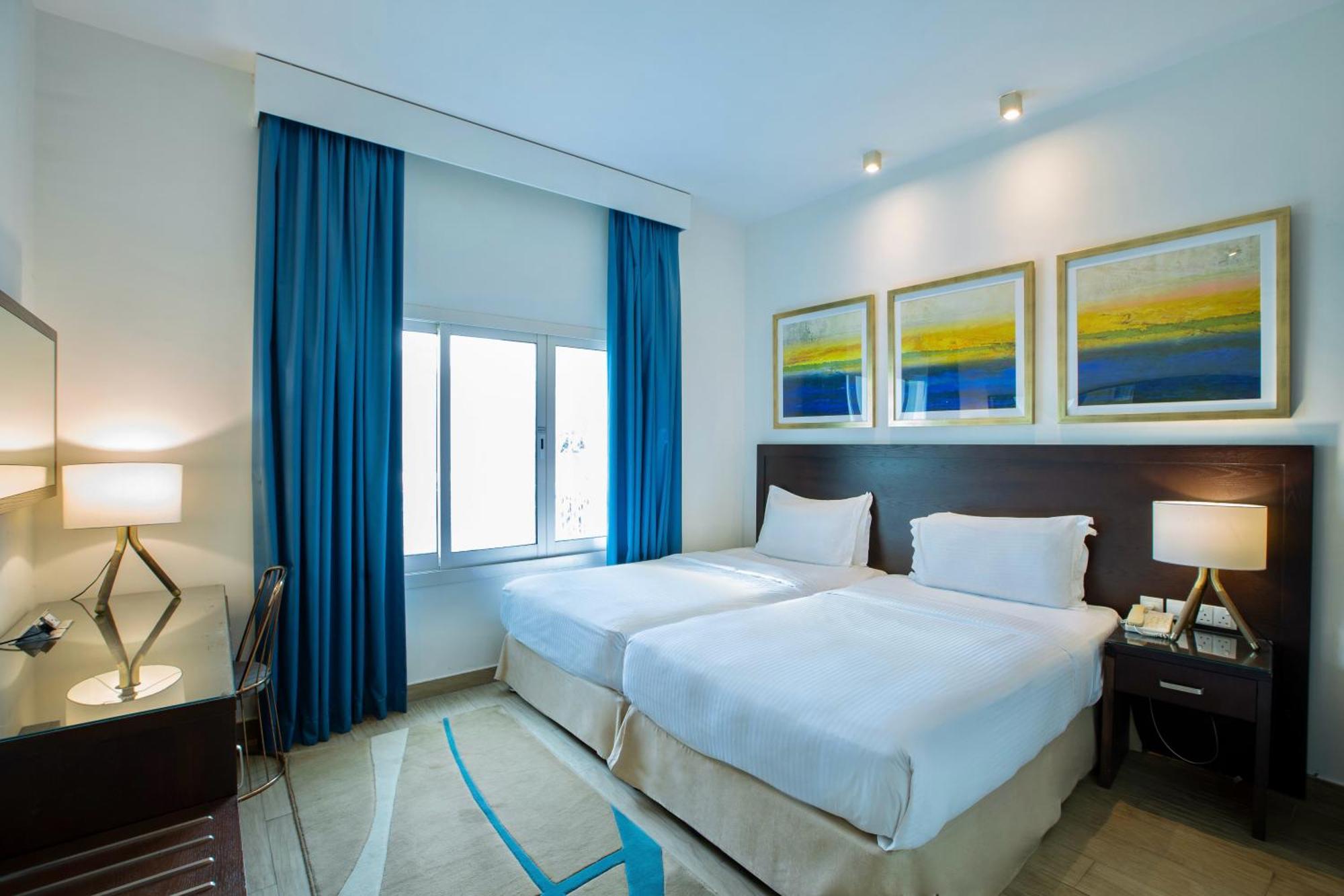 Radisson Blu Resort, Эль-Фуджайра Экстерьер фото A bedroom at the hotel